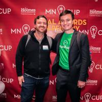 Two Carlson School alumni pose together at MN Cup competition