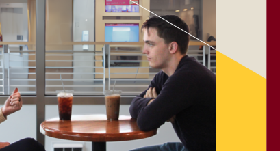 A student and a professor have a conversation over coffee.